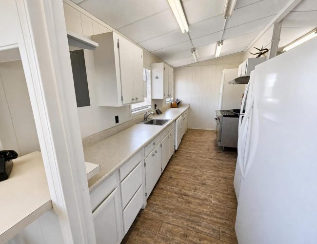 3E Ranch mess hall galley kitchen with range and two refrigerators