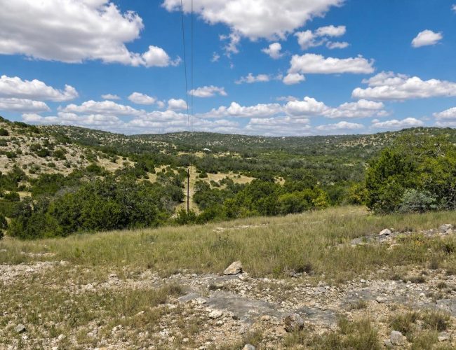 3E Ranch rocky ridge view of brushy valley and distant hills, Edwards County, Texas